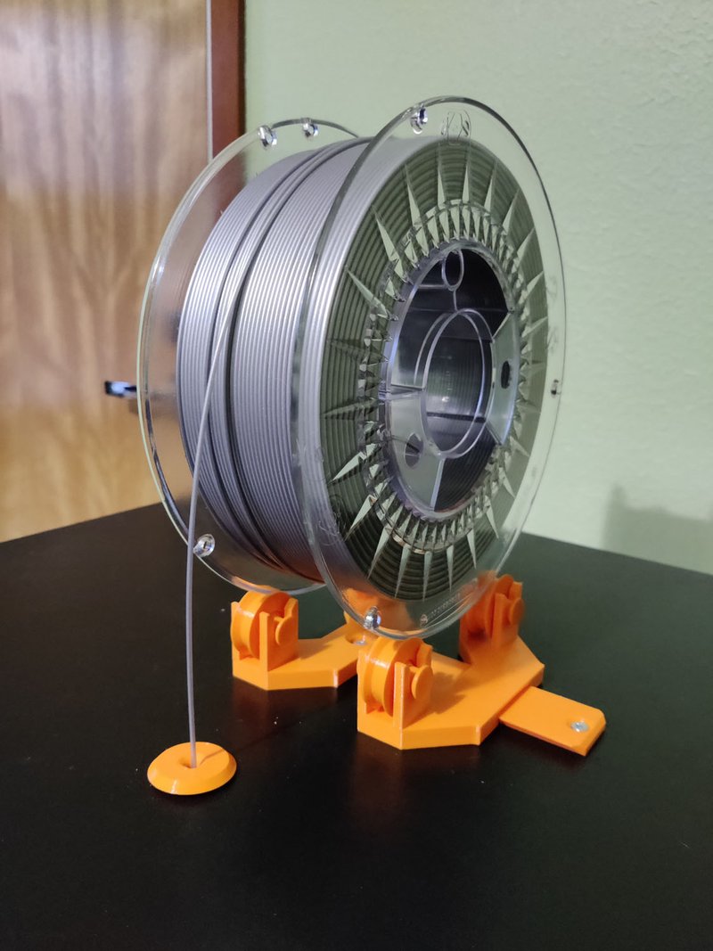 The printer filament holder on top of the enclosure