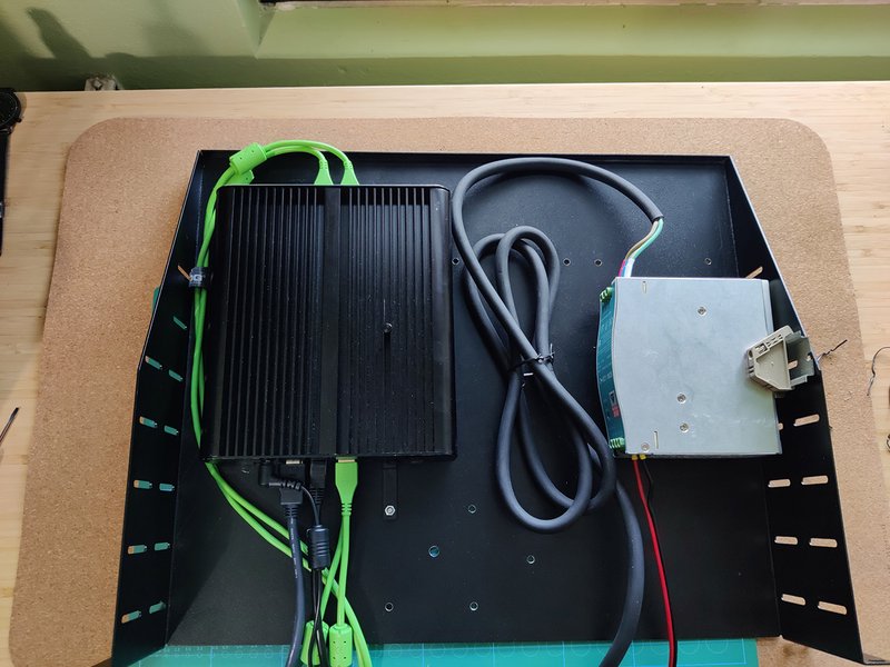 The 2U rack shelf with the Intel NUC and 12V power supply mounted on Photo of the rack shelf and contents
