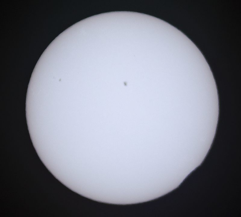 First contact! Photo of the moon barely eclipsing the sun