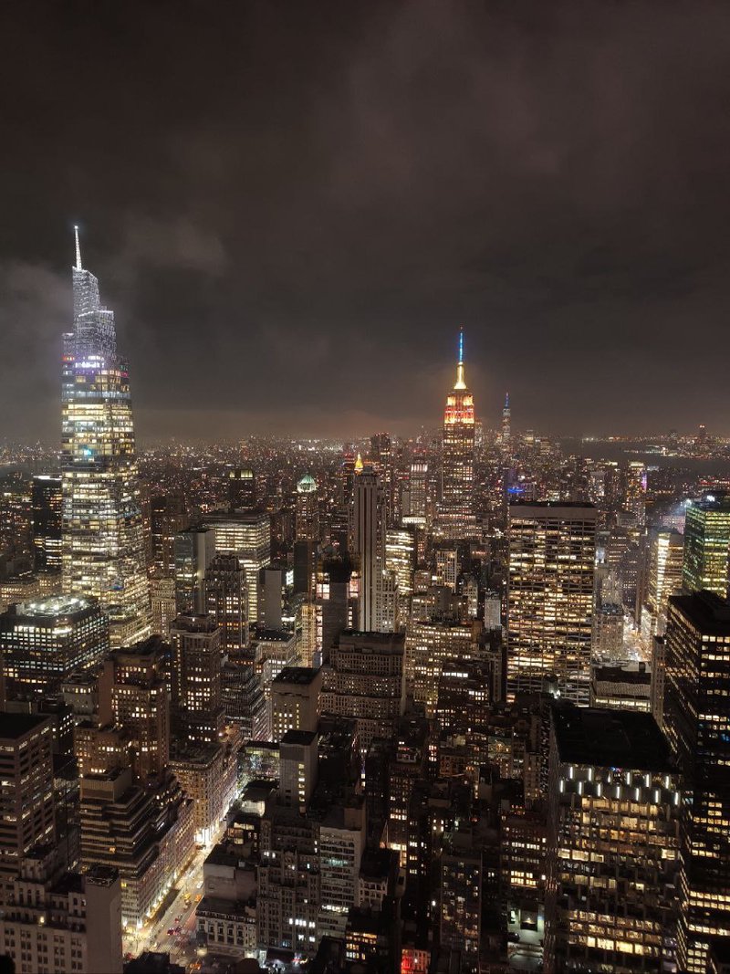 View from the Top of The Rock observation deck at night time. Skyscrapers at night time